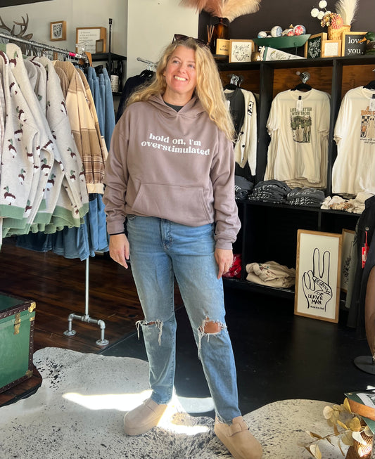 HOLD ON I’M OVERSTIMULATED HOODIE