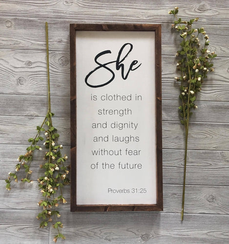 SHE IS CLOTHED IN STRENGTH